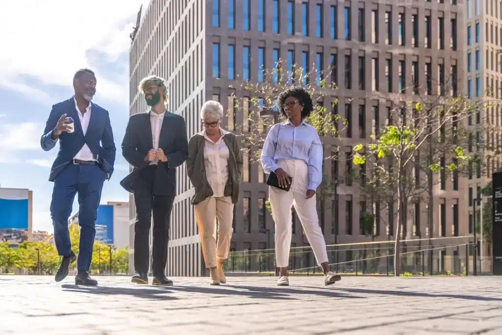 A image of a multiracial group walking to a office to start a business in brazil.